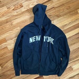 Medium size navy New York zip hoodie.